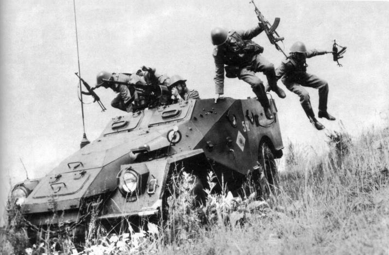 Troops dismount from a BTR-40